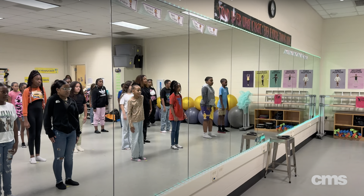  Dance program students warming up for their class